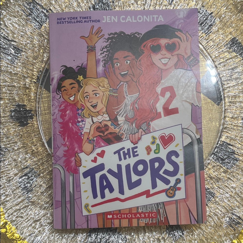 Scholastic The Taylors Book with Pink and Red Cover